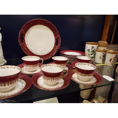43 - An Austria tea set comprising of six cups and saucers, cake plate and sandwich plate