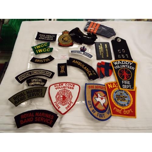 148 - A selection of military and civil cloth badges