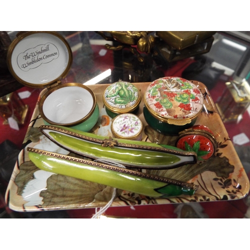 172 - A selection of Crummles enamel pill pots and a Peint Main Limoges bean example