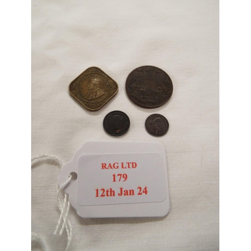 179 - A bronze coin East Indian Company Quarter Anna 1935 together with a George III silver penny 1800, a ... 