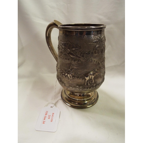 219 - An Indian sterling silver tankard with embossed pictorial scene 10.5 oz