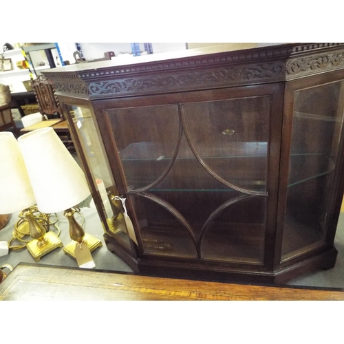 356 - A small bow front glass display cabinet with single glass shelf