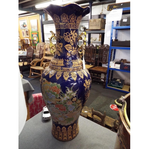 366 - A large blue ground and floral decorated vase 24