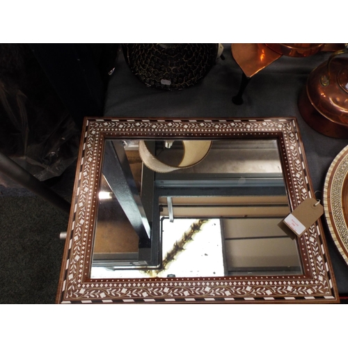 390 - An Indian framed wall mirror inlaid with bone