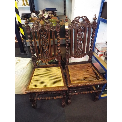 438 - A pair of Jacobean carved oak hall chairs, one A/F