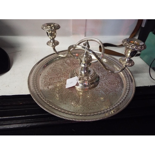 452 - A silver-plated candelabra and a silver-plated round tray