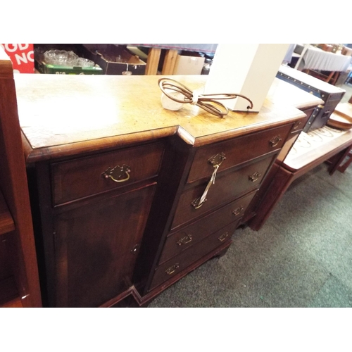 610 - A walnut crossbanded breakfront sideboard having six short drawers flanked by cupboards