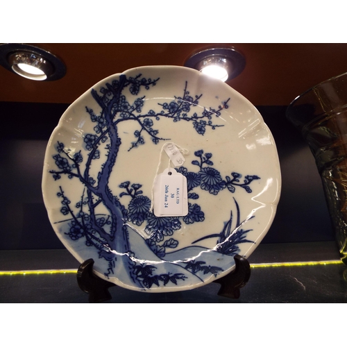 30 - An Oriental plate having prunus decoration marks to rear