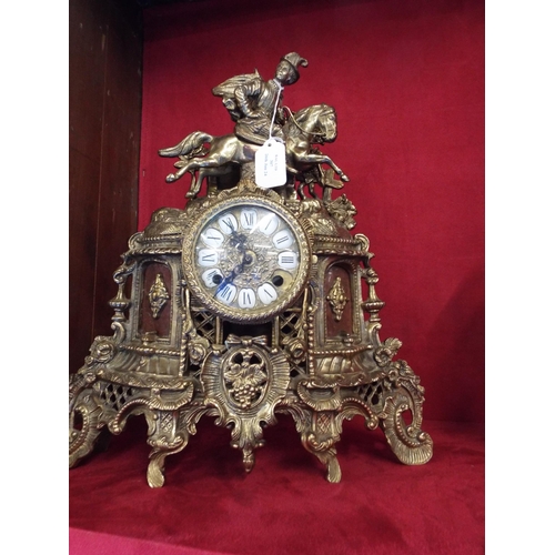 307 - An ornate brass mantel clock with Quartz movement