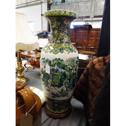 354 - An oriental vase with pictorial panel decoration mounted on wooden base