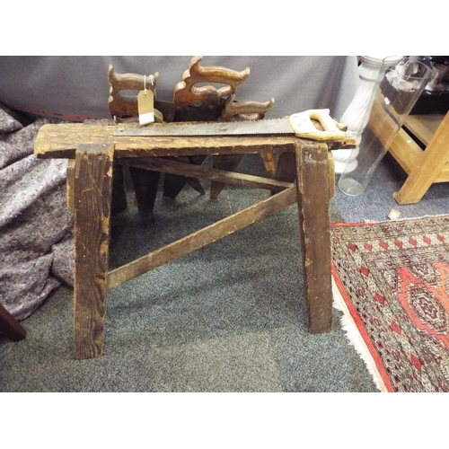 370 - A vintage wooden saw horse and saws