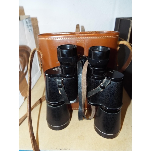 394 - A pair of Kremp 7 x 50 binoculars housed in a leather case