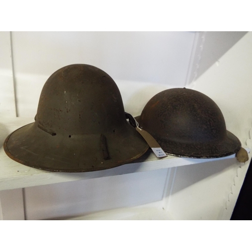 409 - Two WWII British Army helmets