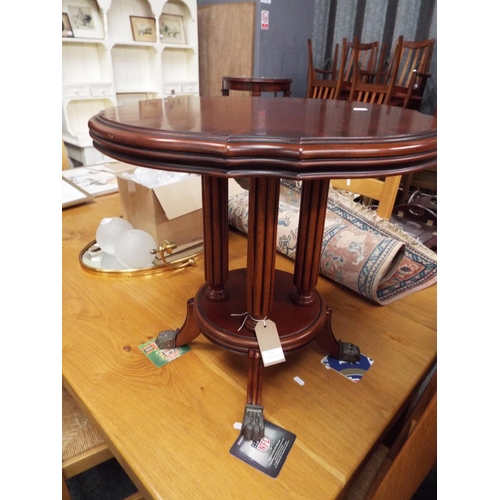 518 - A stained wood circular side table with fluted supports