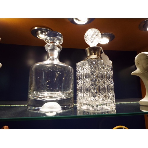 59 - A Krosno of Poland lead crystal decanter and a white metal collared example