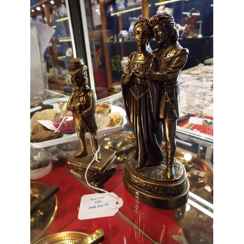 233 - A brass figure of David Copperfield and another of a courting couple