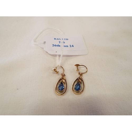 246 - A pair of vintage earrings inset with blue stone