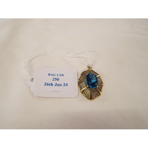 250 - A 9ct gold pendant inset with large oval blue topaz