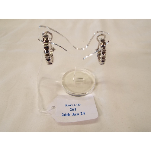 261 - A pair of 18K white gold hoop earrings inset with diamonds