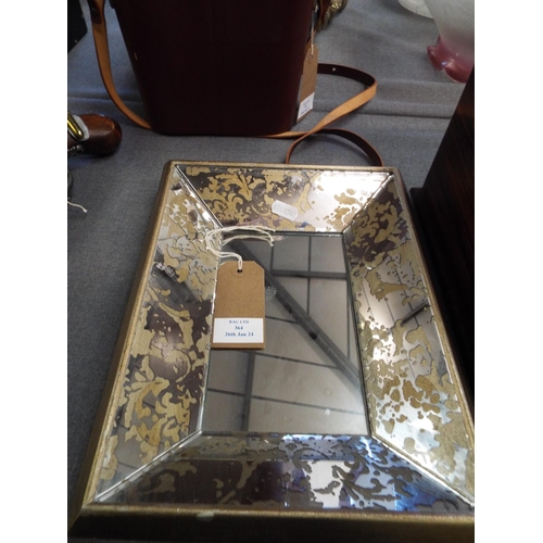 364 - A small cushion bevel glass mirror