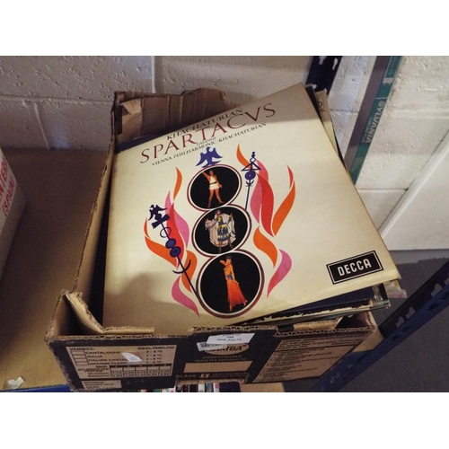 388 - A box of assorted LP's and 45rpm to include Hazel O'Connor, Sample Minds, The Stranglers