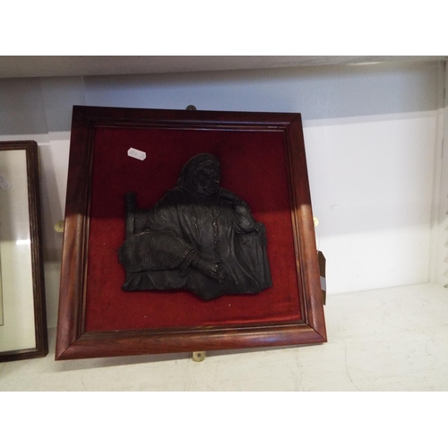 427 - A plaque of Queen Victoria mounted on wooden frame