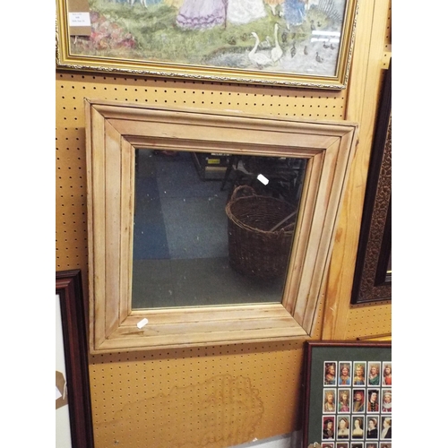 449 - A limed oak framed mirror