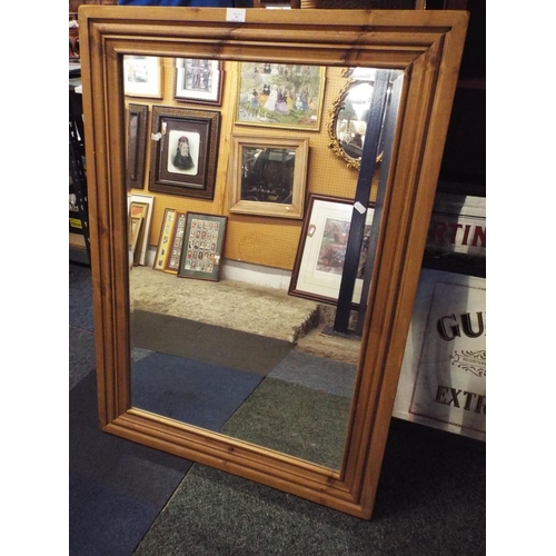 460 - A pine framed bevel glass mirror