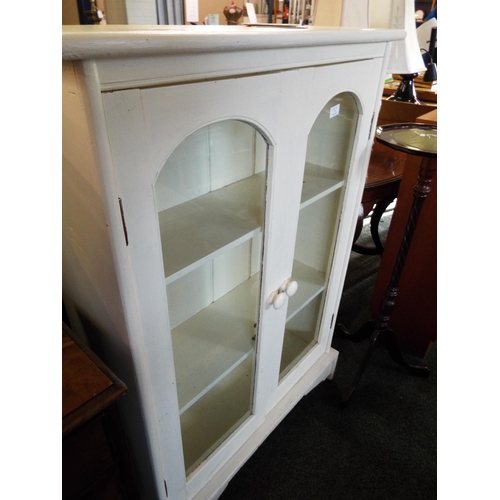 550 - A white painted oak glazed bookcase having two shelves