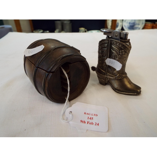 145 - A vintage wooden barrel housing four brass ash trays and a cowboy boot lighter