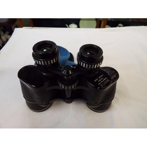 146 - A pair of vintage Boots Compact De Lux 10 x 50 binoculars