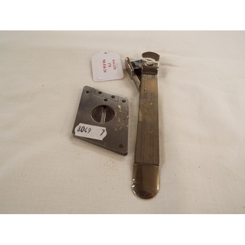 174 - Two vintage cigar cutters