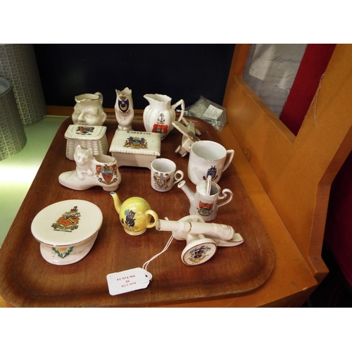 35 - A mixed selection of assorted crested ware to include a WW1 Officers Cap, a monoplane, cannon etc