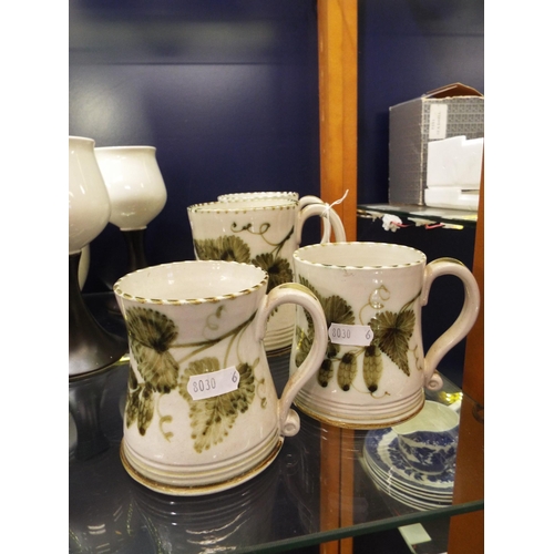 41 - Four Rye Pottery tankards with hop and vine decoration one A/F