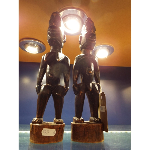 59 - A pair of carved wooden African figures