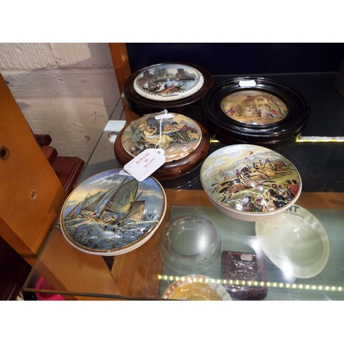 66 - A selection of antique pot lids, some framed