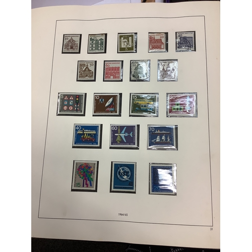 75 - An album housing a selection over 100 German mint stamps dating from 1964 to 1977