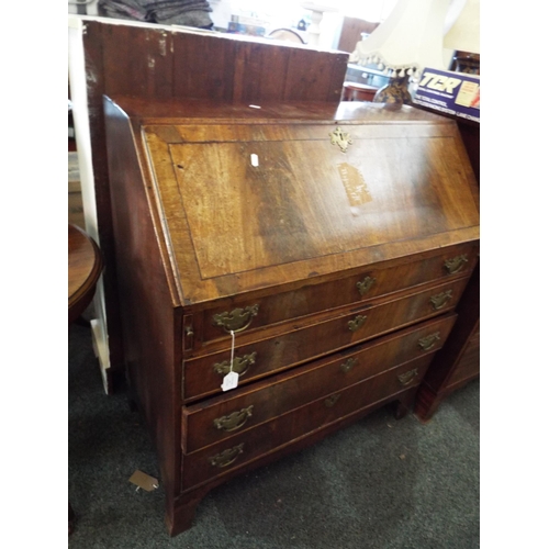 529 - A Georgian mahogany bureau the fall flap enclosing inner compartments above four long graduating dra... 