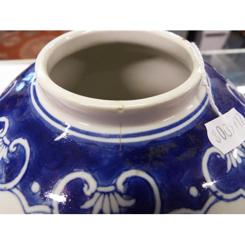 1 - A Chinese ginger jar with prunus decoration together with an Oriental blue and white jar