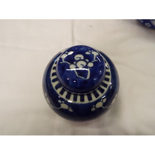 1 - A Chinese ginger jar with prunus decoration together with an Oriental blue and white jar