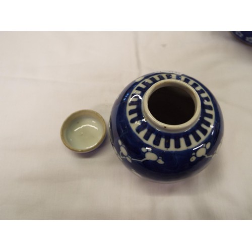 1 - A Chinese ginger jar with prunus decoration together with an Oriental blue and white jar