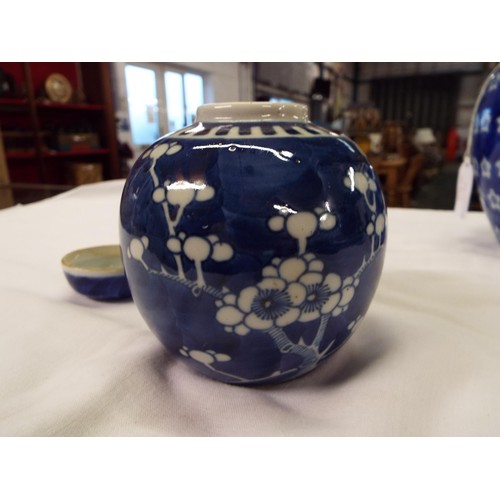 1 - A Chinese ginger jar with prunus decoration together with an Oriental blue and white jar