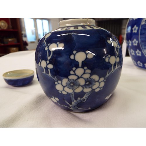 1 - A Chinese ginger jar with prunus decoration together with an Oriental blue and white jar