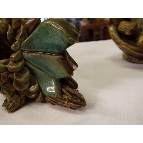 25 - A vintage Yare six legged pottery dragon together with one in seated position and one hatching