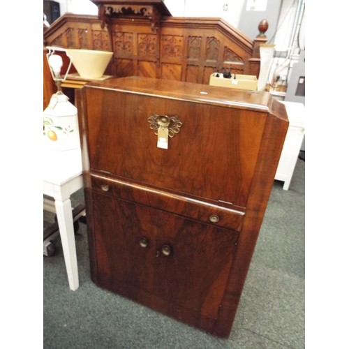 521 - A retro teak Turnidge cocktail cabinet the hinged flap enclosing mirror with drawer and cupboard und... 