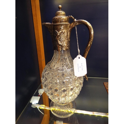 26 - A London 1884 silver and cut glass claret jug, the silver spout having bird and floral decoration