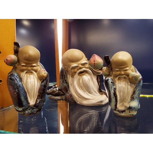 44 - Three Chinese mud figures