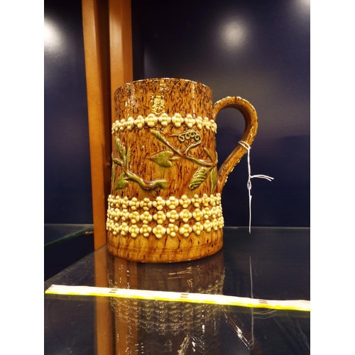 6 - A circa 1900 Rye Pottery tankard having sprigged convolvulus in a central band between rows of cream... 