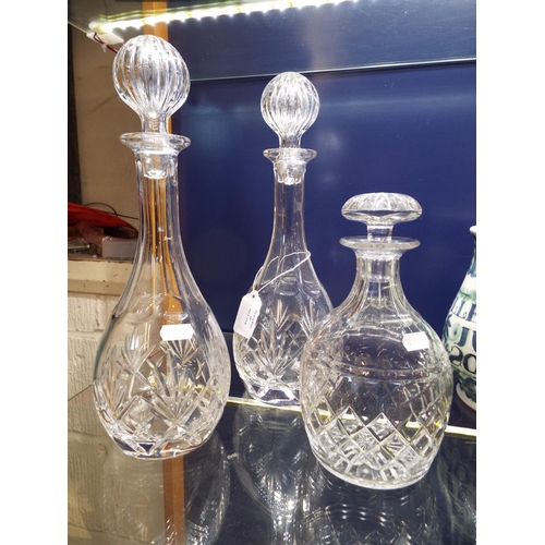 69 - Three crystal glass decanters