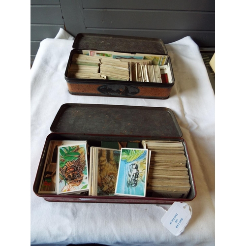 110 - Two vintage tins of loose cigarette cards